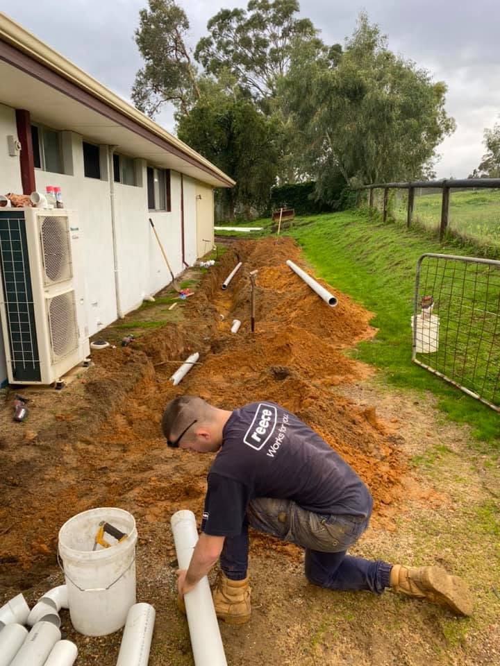 New drainage pipework laid alongside a home