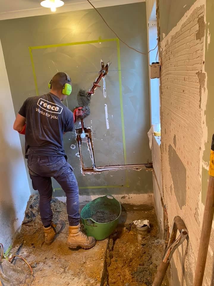 Bathroom rough-in pipework chased into the wall