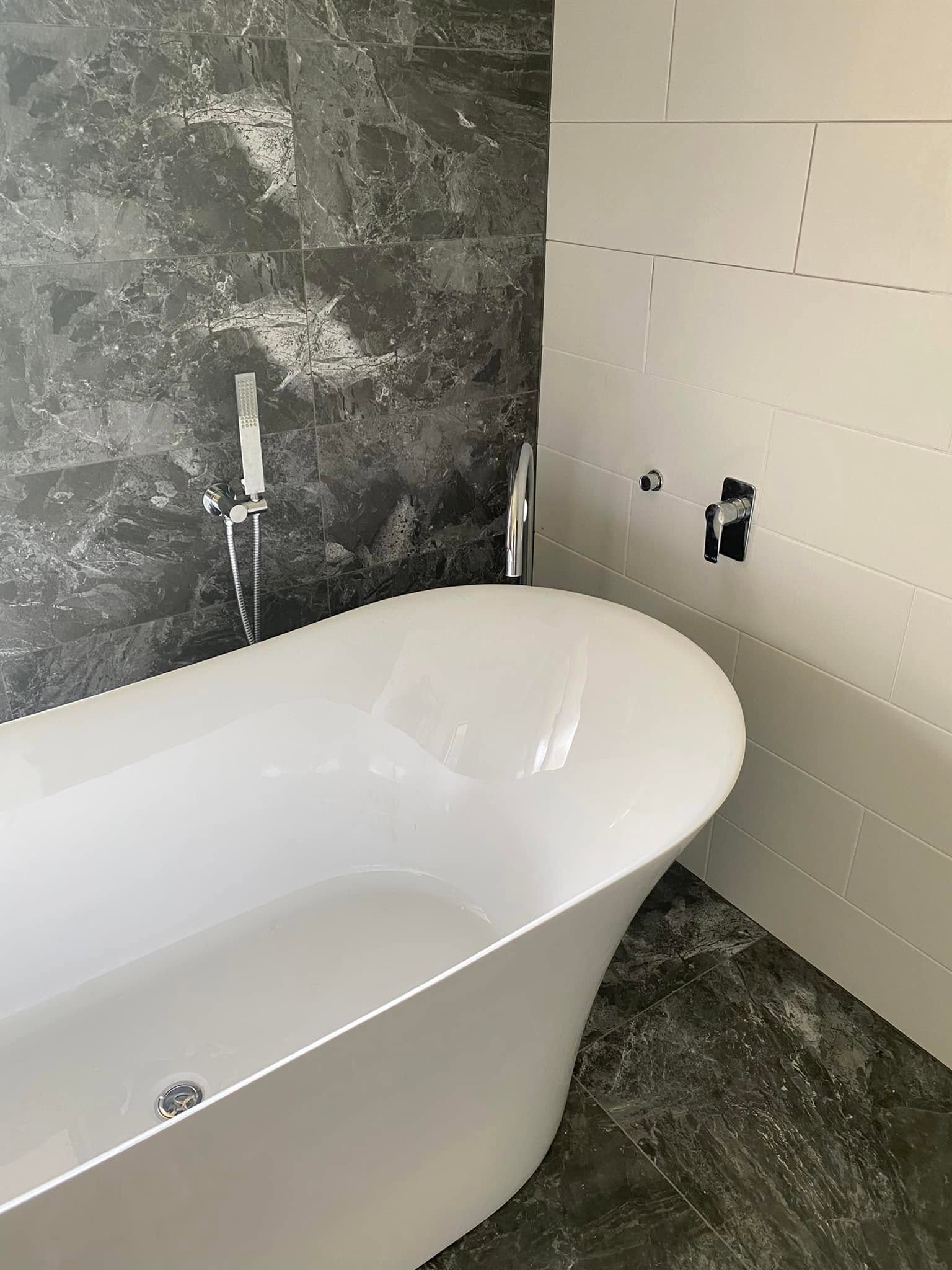 Freestanding bath in a modern bathroom renovation