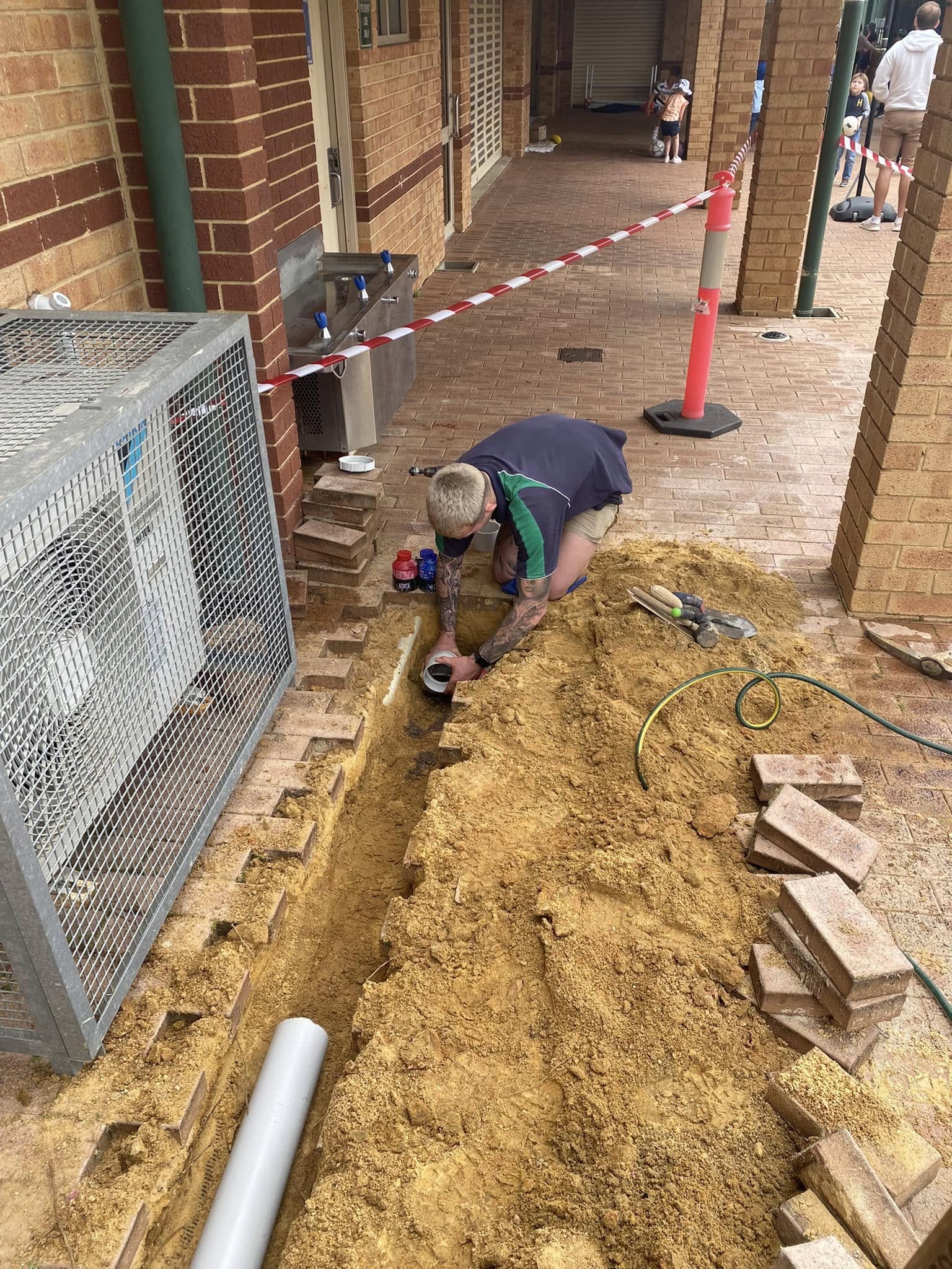 Repairing underground pipework in a walkway